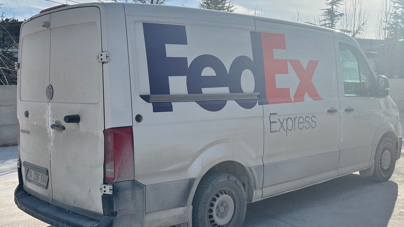 FedEx van parked outdoors with a clear sky in the background