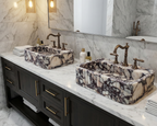 Bathroom vanity with marble sinks, dark wood cabinets, and decorative bottles.