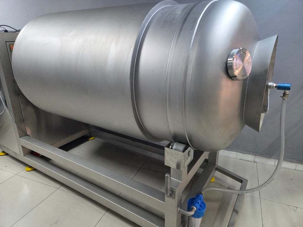 Large metallic tank with a pressure gauge on a tiled floor